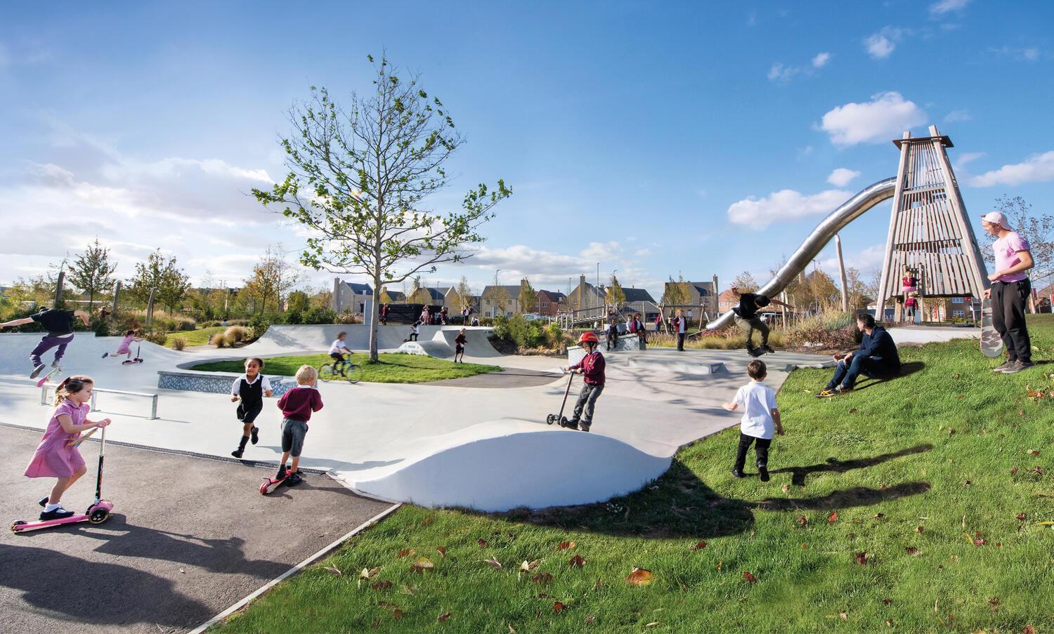 Young children using the skate park at Alconbury Weald
