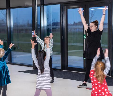 Children and teacher doing ballet