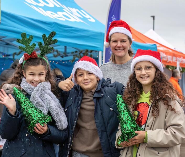 Natalie Leigh-Brown, Community Lead for Alconbury Weald master developer Urban&Civic with some of the Ermine Street Church Academy singers.