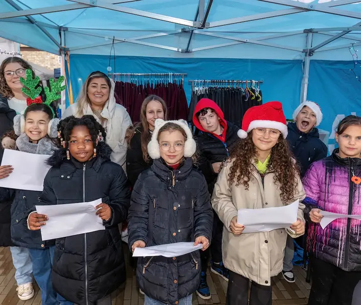 Children from Ermine Street Church Academy delighted market goers with carols and festive tunes.