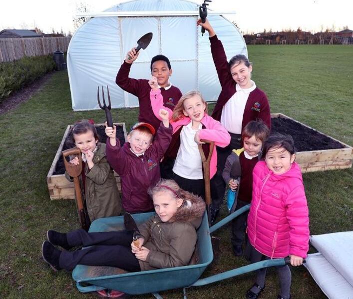 Ermine Street pupils celebrate as Morris Homes support new allotments