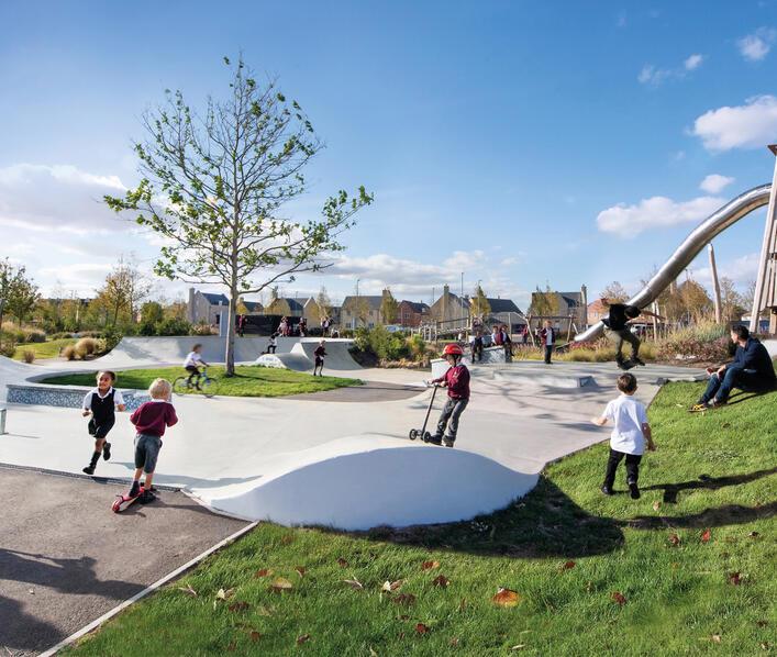 Young children using the skate park at Alconbury Weald