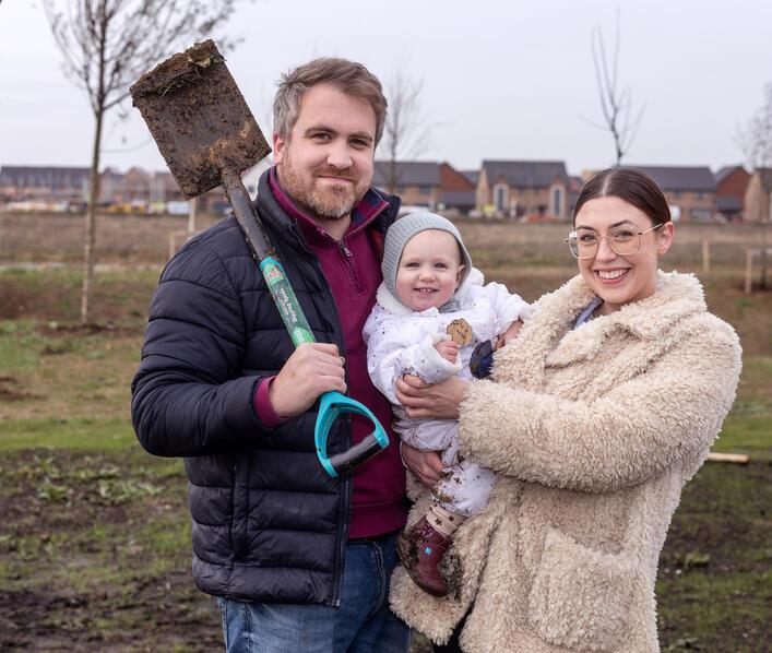 A family at the community tree planting event 