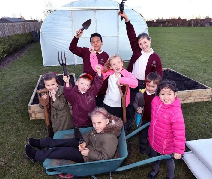 Ermine Street pupils celebrate as Morris Homes support new allotments